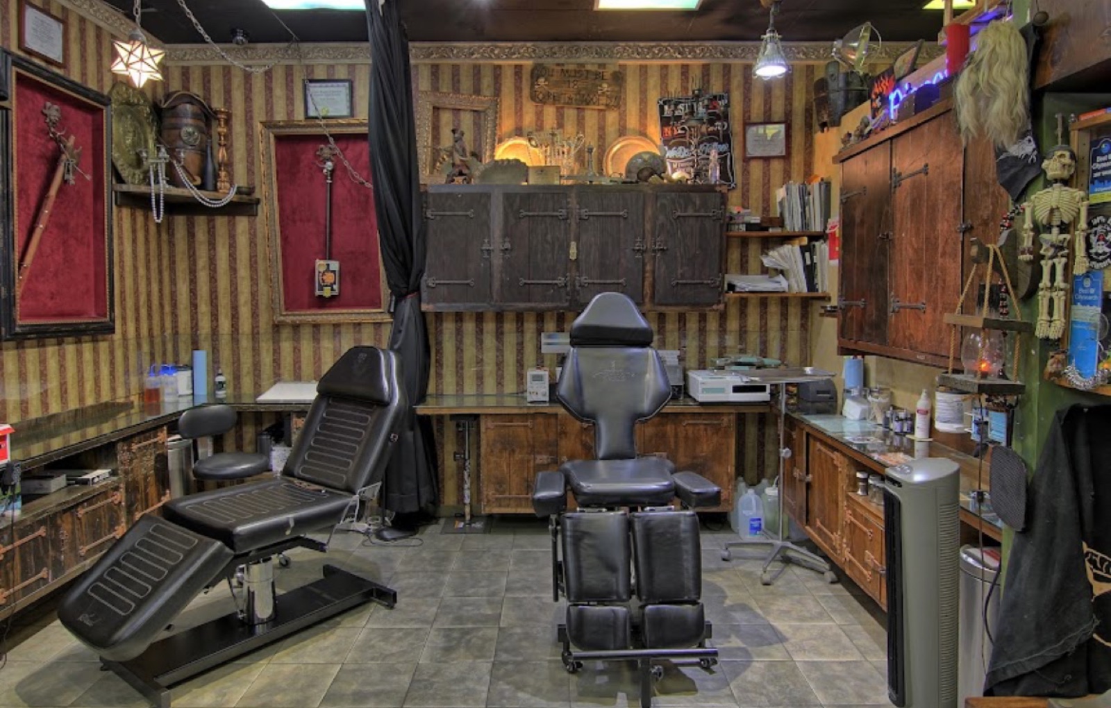 The studio: one tattoo chair in a wood-paneled room.